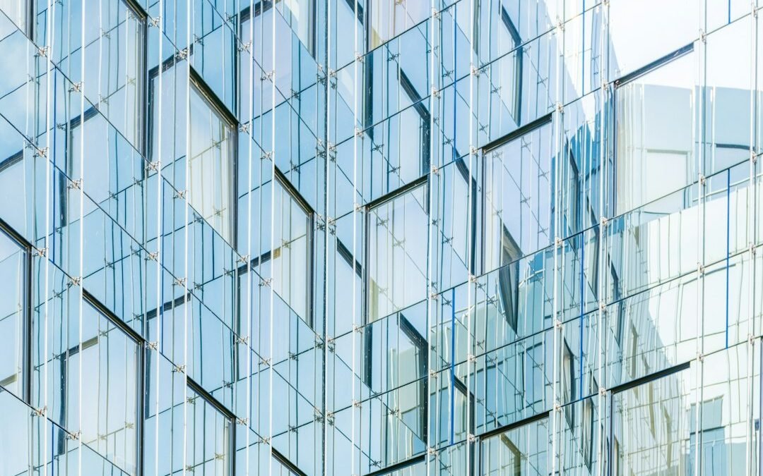Modern glass curtain wall façade illustrating curtain wall thermal modeling and thermal bridging considerations under NECB 2025